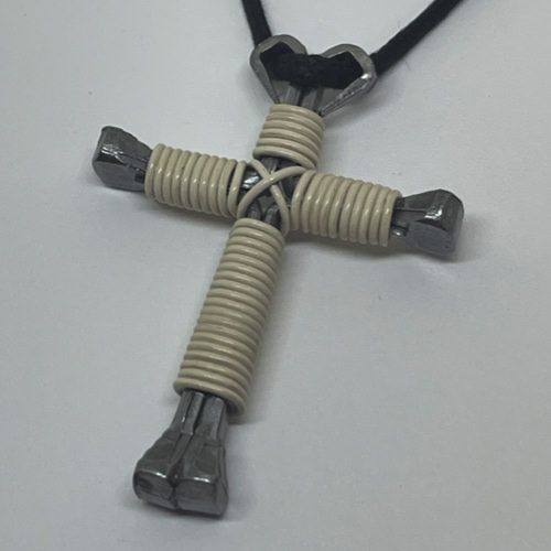 Nail cross necklace wrapped with bold antique white wire.