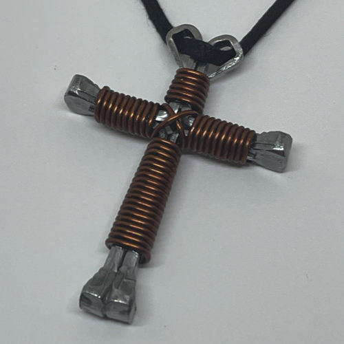 Nail cross necklace wrapped with brown wire.