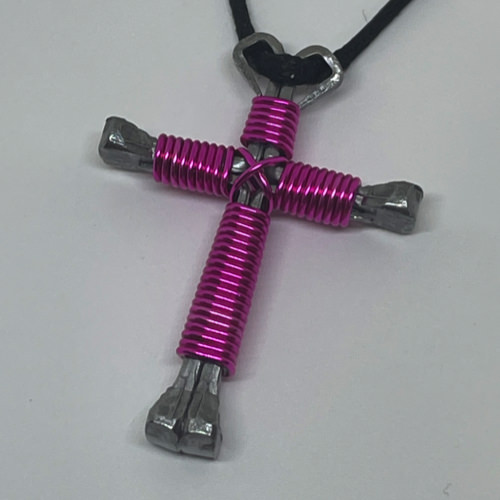 Nail cross necklace wrapped with bold fushia wire.