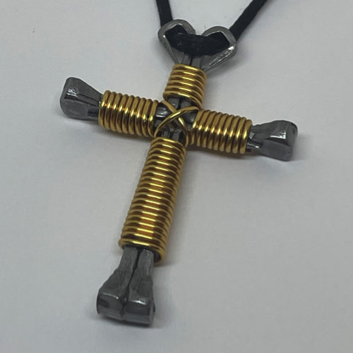 Nail cross necklace wrapped with bold golden wire.