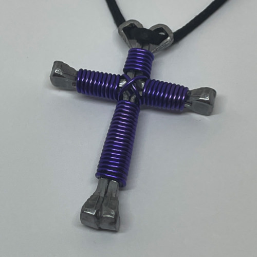 Nail cross necklace wrapped with bold lavender wire.