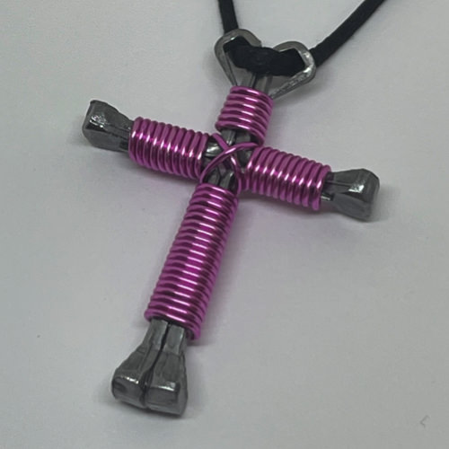 Nail cross necklace wrapped with bold light pink wire.