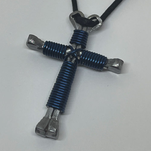 Nail cross necklace wrapped with bold navy wire.