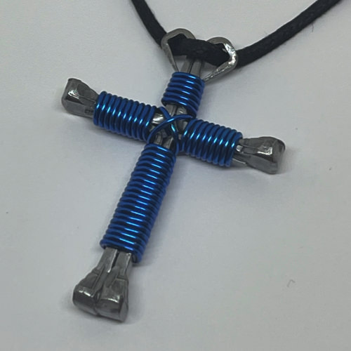 Nail cross necklace wrapped with bold royal wire.