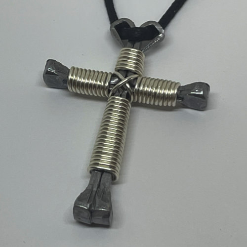 Nail cross necklace wrapped with bold shiny silver wire.