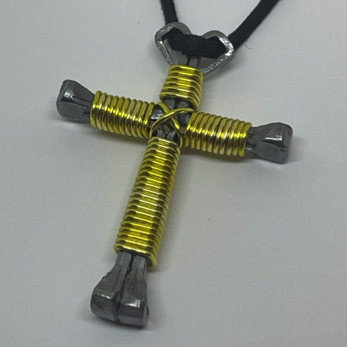 Nail cross necklace wrapped with bold yellow wire.