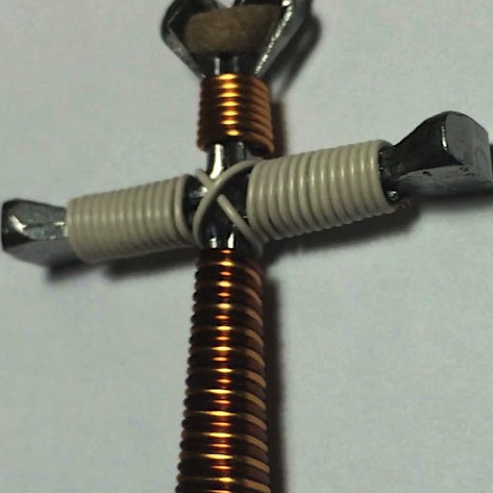 Tan camo horseshoe cross made with nails