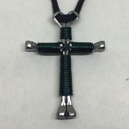teal nails cross necklace