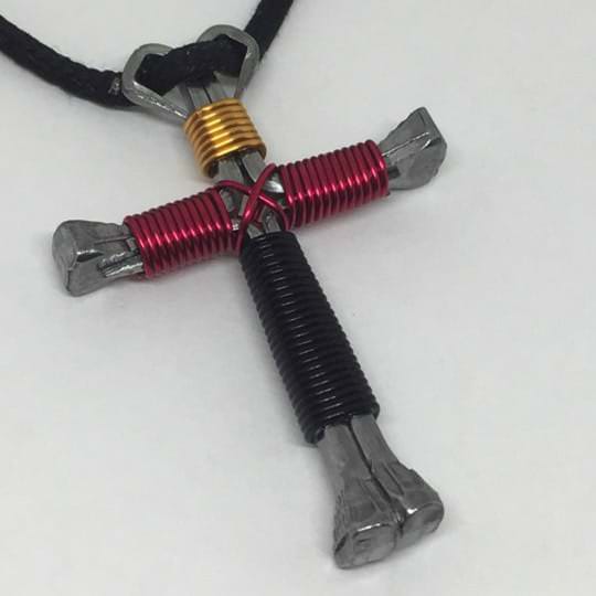 gold black red horseshoe nail cross necklace gold top black bottom and magenta arms nail cross necklace made with horseshoe nail