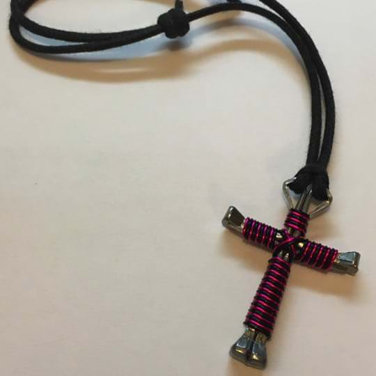 cross anklet made with nails striped with pink and black wire