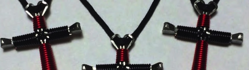 nail cross necklace shown in two colors