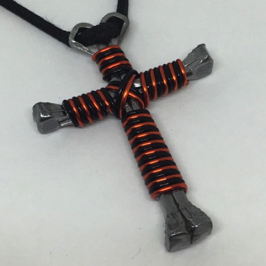 This is a orange and black double cross necklace orange black cross double cross necklace