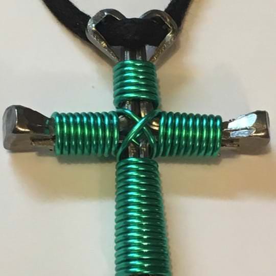 Seafoam nail cross necklace showing wire upclose Seafoam nail cross necklace showing the vibrant color of the enamel wire