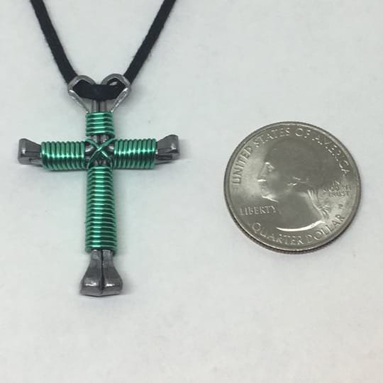 Seafoam Nail Cross Necklace shown with Quarter for size comparison Seafoam Nail Cross Necklace shown with Quarter